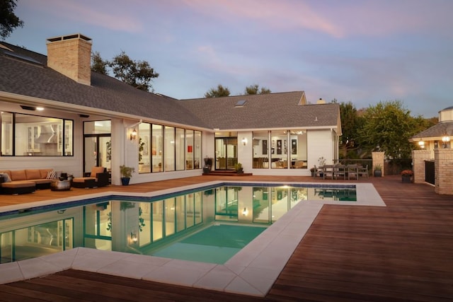 17 Cousteau Ln, Austin, TX 78746 - view of swimming pool featuring an outdoor hangout area, a patio, french doors, and a deck