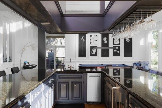 17 Cousteau Ln, Austin, TX 78746 - bar area featuring a decorative wall, beverage cooler, and pool table