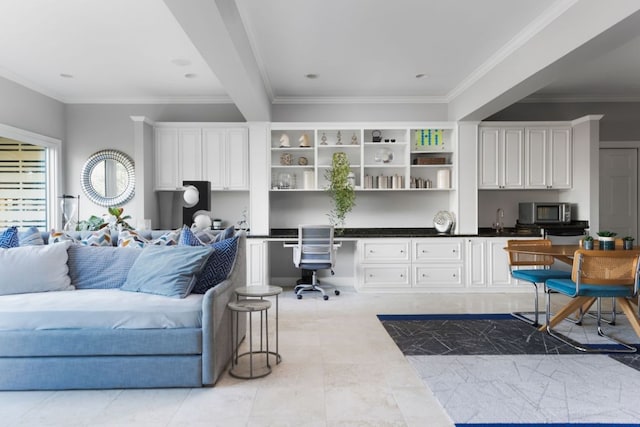 17 Cousteau Ln, Austin, TX 78746 - kitchen with stainless steel microwave, open shelves, built in desk, ornamental molding, and white cabinetry