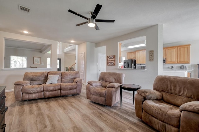 2209 Callaway Garden Ct, Pflugerville, TX 78660 - living area featuring light wood-type flooring, ceiling fan, stairs, baseboards, and recessed lighting