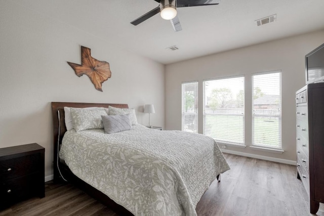 2209 Callaway Garden Ct, Pflugerville, TX 78660 - bedroom with wood finished floors, baseboards, and a ceiling fan