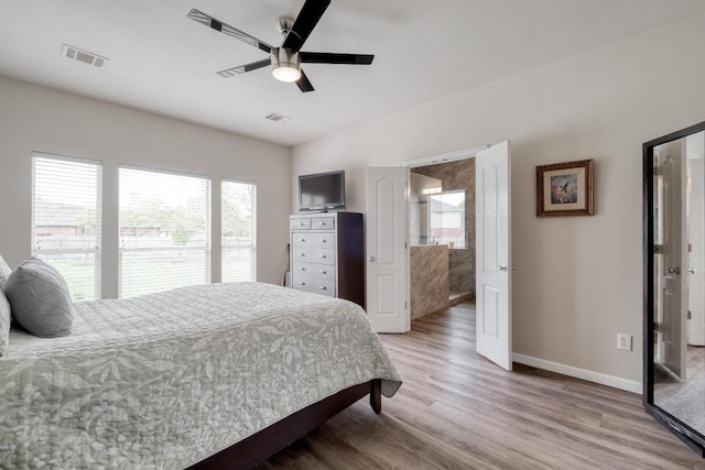 2209 Callaway Garden Ct, Pflugerville, TX 78660 - bedroom with multiple windows, light wood-style flooring, baseboards, and a ceiling fan
