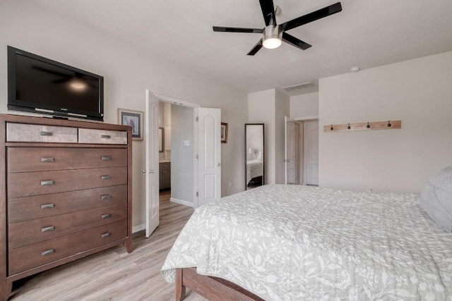 2209 Callaway Garden Ct, Pflugerville, TX 78660 - bedroom with light wood-style floors, baseboards, and a ceiling fan