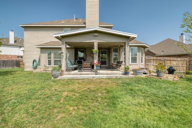 2209 Callaway Garden Ct, Pflugerville, TX 78660 - rear view of property featuring a patio, a chimney, and roof with shingles