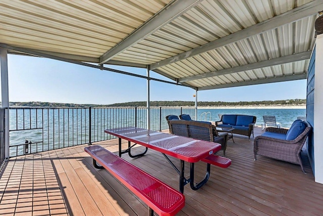 view of dock featuring outdoor lounge area and a water view