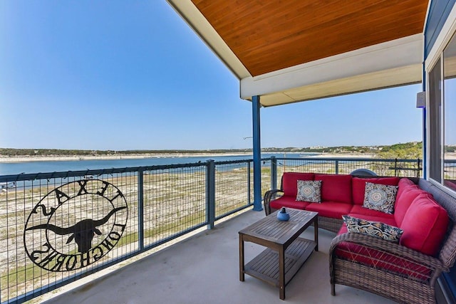balcony featuring an outdoor living space and a water view