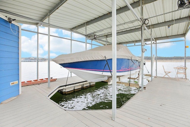 view of dock with a water view and boat lift