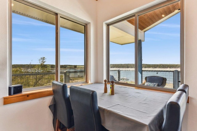 dining space featuring a water view