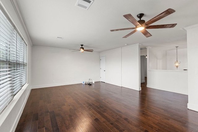 1290 Sweet Gum Dr, Kyle, TX 78640 - unfurnished living room with ceiling fan, wood finished floors, baseboards, and crown molding