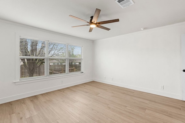 1290 Sweet Gum Dr, Kyle, TX 78640 - spare room featuring ornamental molding, a ceiling fan, light wood-style flooring, and baseboards