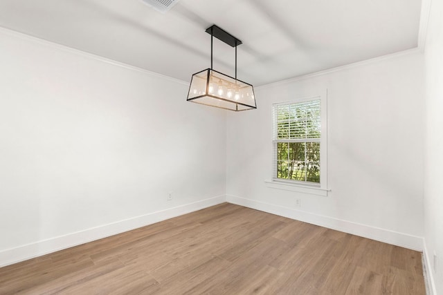 1290 Sweet Gum Dr, Kyle, TX 78640 - spare room featuring light wood-style flooring, ornamental molding, and baseboards