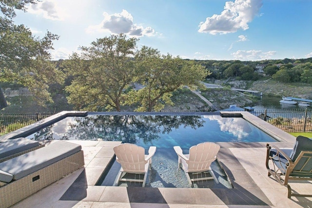 22000 Briarcliff Dr, Spicewood, TX 78669 - view of swimming pool featuring a patio and a water view