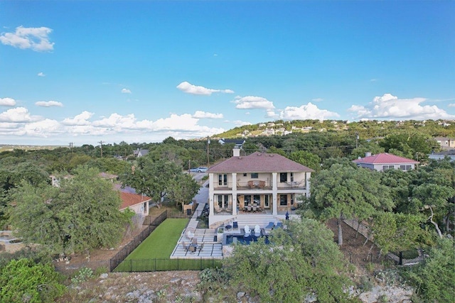22000 Briarcliff Dr, Spicewood, TX 78669 - rear view of property featuring a balcony, a fenced backyard, and a patio area