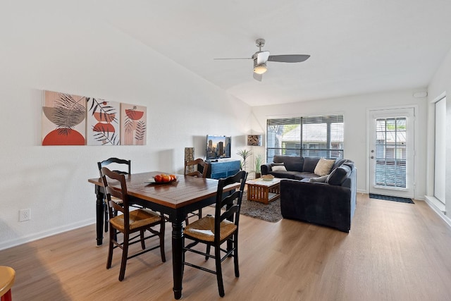 1101 Hollow Creek Dr Unit 2203, Austin, TX 78704 - dining room with light wood-style flooring, a ceiling fan, baseboards, and vaulted ceiling
