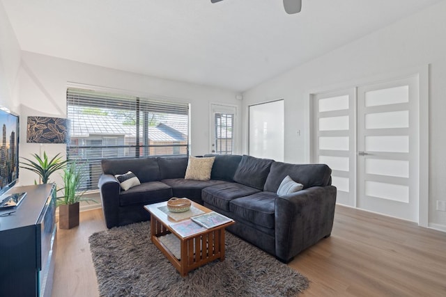 1101 Hollow Creek Dr Unit 2203, Austin, TX 78704 - living area with wood finished floors, plenty of natural light, a ceiling fan, and vaulted ceiling