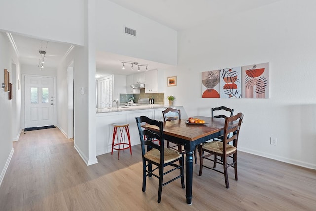 1101 Hollow Creek Dr Unit 2203, Austin, TX 78704 - dining space featuring light wood-type flooring and baseboards