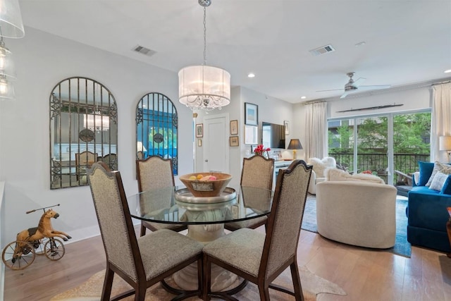 908 Nueces St Unit 36, Austin, TX 78701 - dining area featuring light wood finished floors, ceiling fan, recessed lighting, and a chandelier