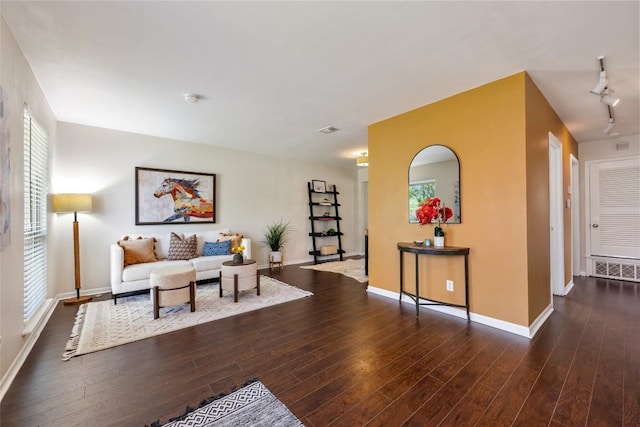 8313 Renton Dr, Austin, TX 78757 - living area featuring baseboards, track lighting, and wood finished floors