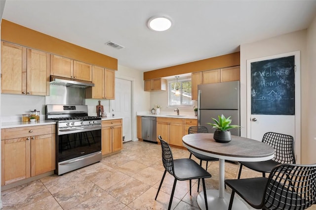 8313 Renton Dr, Austin, TX 78757 - kitchen featuring light brown cabinetry, a sink, stainless steel appliances, under cabinet range hood, and visible vents