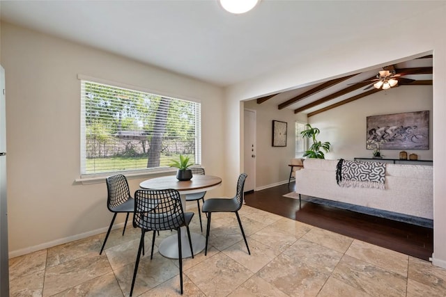 8313 Renton Dr, Austin, TX 78757 - dining area with vaulted ceiling with beams, a ceiling fan, baseboards, and stone finish floor