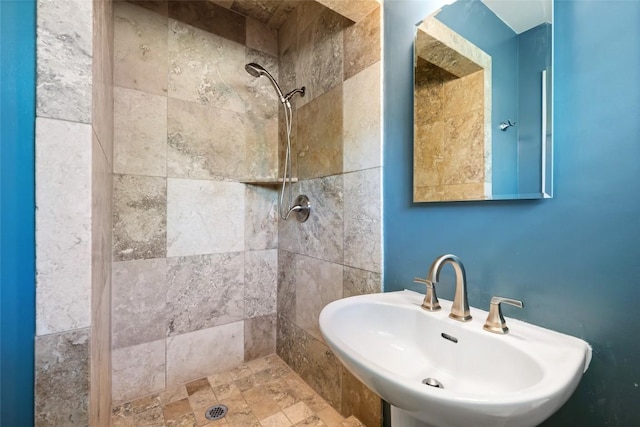 8313 Renton Dr, Austin, TX 78757 - bathroom featuring tiled shower and a sink