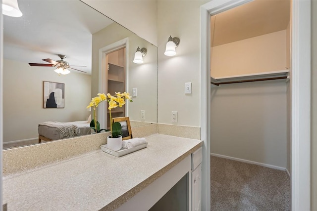 8313 Renton Dr, Austin, TX 78757 - bathroom featuring vanity, baseboards, and a ceiling fan