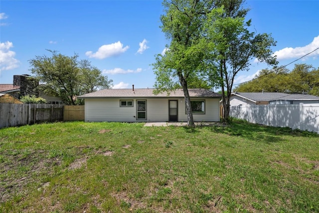 8313 Renton Dr, Austin, TX 78757 - back of house with a lawn, a fenced backyard, and a patio area