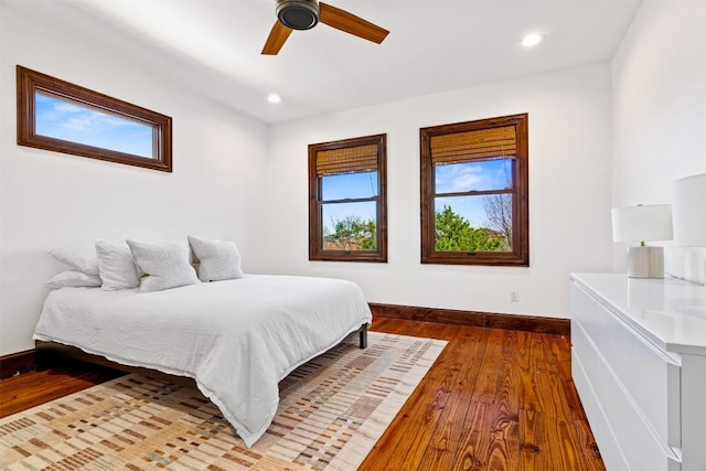 11 Hightrail Way, Austin, TX 78738 - bedroom featuring hardwood / wood-style flooring, baseboards, a ceiling fan, and recessed lighting