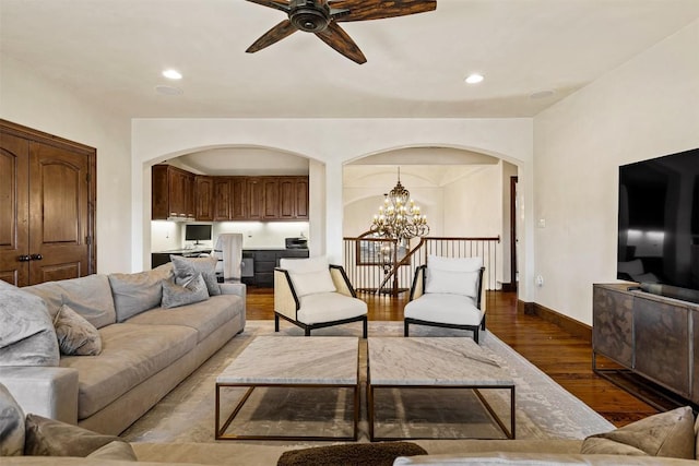 11 Hightrail Way, Austin, TX 78738 - living room with arched walkways, a chandelier, a ceiling fan, wood finished floors, and recessed lighting