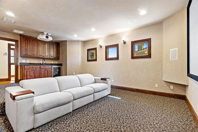 11 Hightrail Way, Austin, TX 78738 - living room featuring wine cooler, baseboards, recessed lighting, and carpet floors
