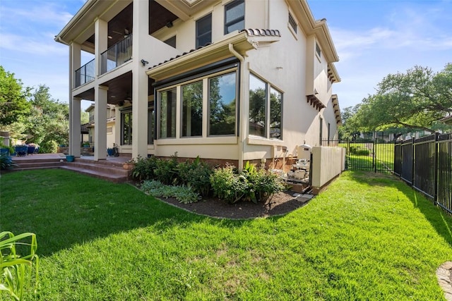 11 Hightrail Way, Austin, TX 78738 - rear view of property with a balcony, a ceiling fan, and stucco siding