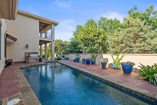 11 Hightrail Way, Austin, TX 78738 - view of swimming pool with exterior kitchen, a patio, and a pool with connected hot tub