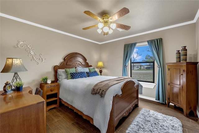 707 Golden Beach Dr, Buchanan Dam, TX 78609 - bedroom with wood tiled floors, baseboards, ornamental molding, and a ceiling fan