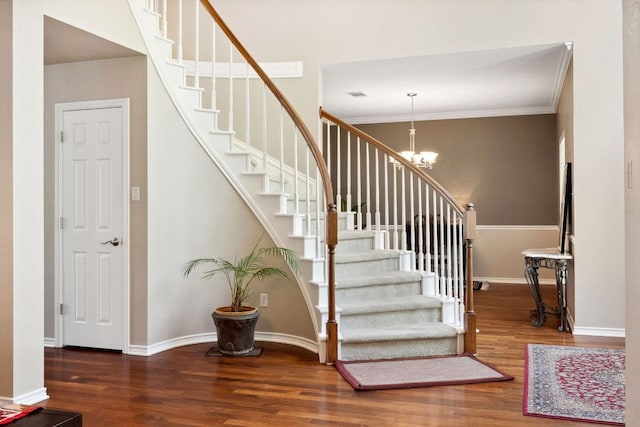 10406 Charette Cv, Austin, TX 78759 - stairs with wood finished floors, crown molding, a chandelier, and baseboards