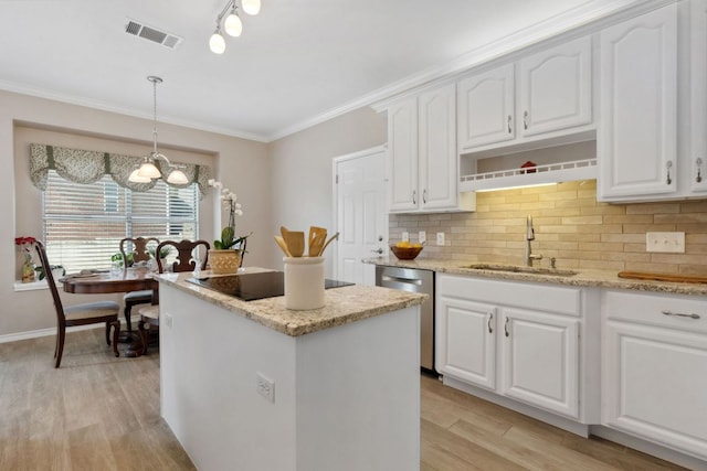 10406 Charette Cv, Austin, TX 78759 - kitchen featuring dishwasher, a sink, black electric stovetop, a kitchen island, and light wood-style floors