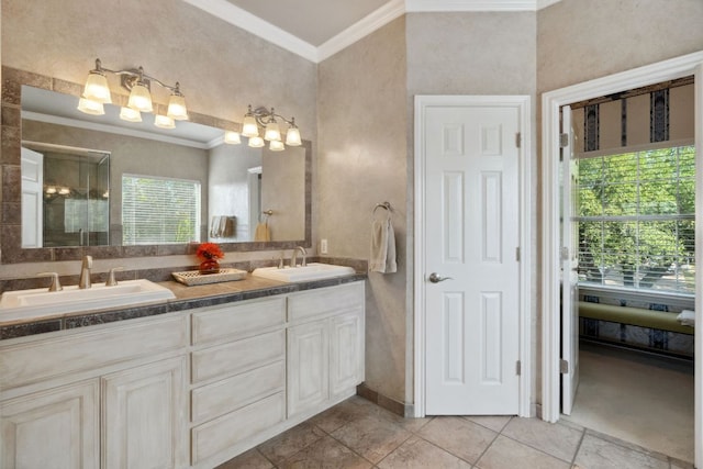 10406 Charette Cv, Austin, TX 78759 - bathroom featuring ornamental molding, plenty of natural light, double vanity, tile patterned floors, and a shower