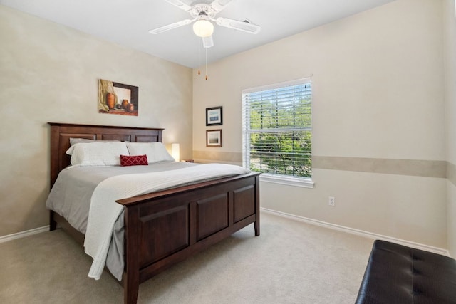 10406 Charette Cv, Austin, TX 78759 - bedroom featuring baseboards, light carpet, and ceiling fan