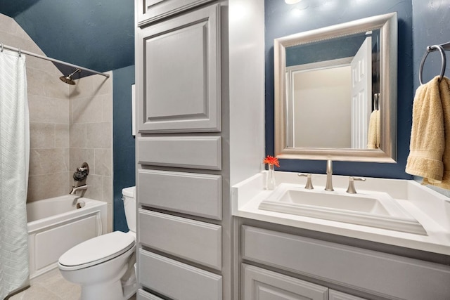 10406 Charette Cv, Austin, TX 78759 - full bath with toilet, vanity, shower / bathtub combination with curtain, and tile patterned floors