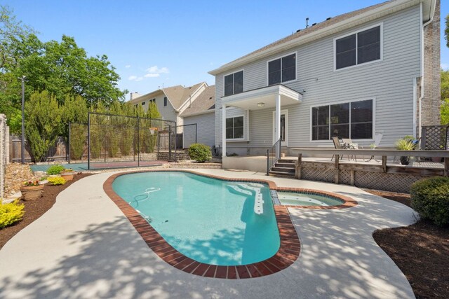 10406 Charette Cv, Austin, TX 78759 - view of pool with a pool with connected hot tub and a wooden deck