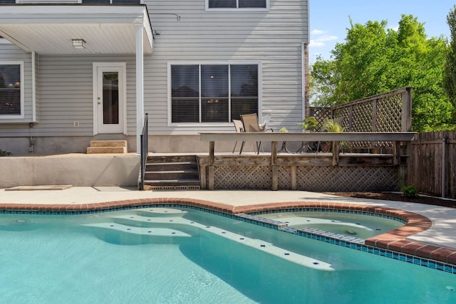 10406 Charette Cv, Austin, TX 78759 - view of pool with entry steps, a pool with connected hot tub, and a wooden deck