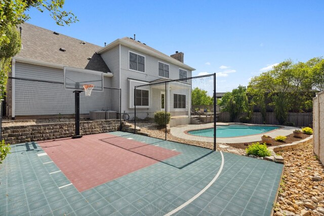 10406 Charette Cv, Austin, TX 78759 - view of basketball court featuring basketball court and a fenced backyard