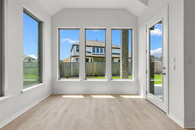 1800 Sauterne Dr, Leander, TX 78641 - unfurnished sunroom featuring wood finished floors, plenty of natural light, and lofted ceiling