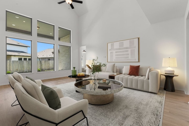 1800 Sauterne Dr, Leander, TX 78641 - living room featuring a ceiling fan, high vaulted ceiling, and wood finished floors