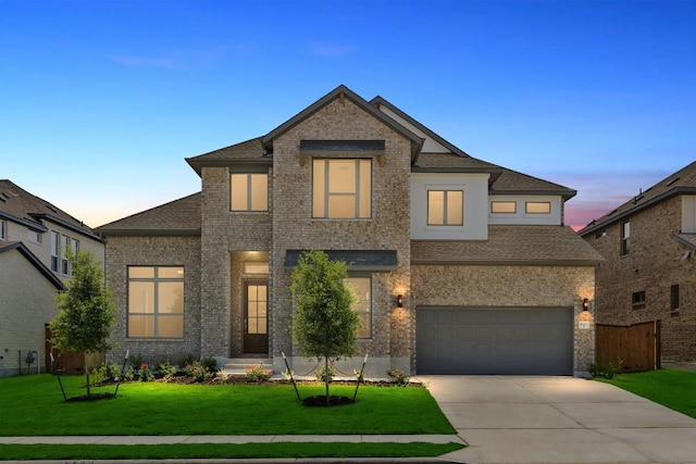 1800 Sauterne Dr, Leander, TX 78641 - view of front of property featuring concrete driveway, brick siding, an attached garage, and roof with shingles
