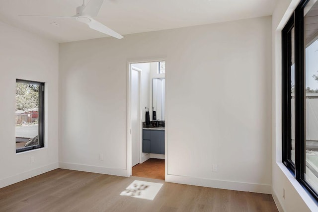 1202 Fieldcrest Dr, Austin, TX 78704 - empty room featuring light wood-style flooring and ceiling fan