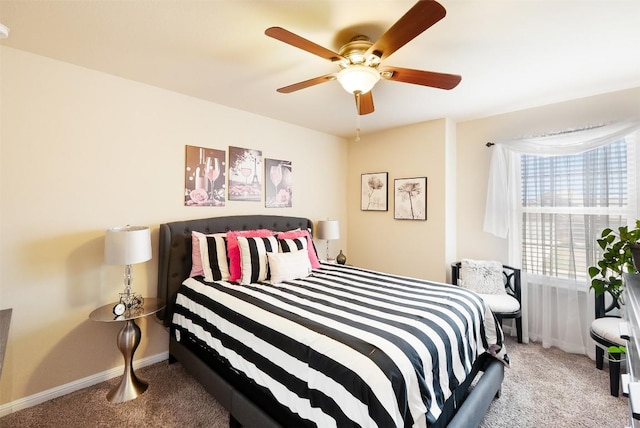 598 Sweet Gum Dr, Kyle, TX 78640 - carpeted bedroom with baseboards and ceiling fan