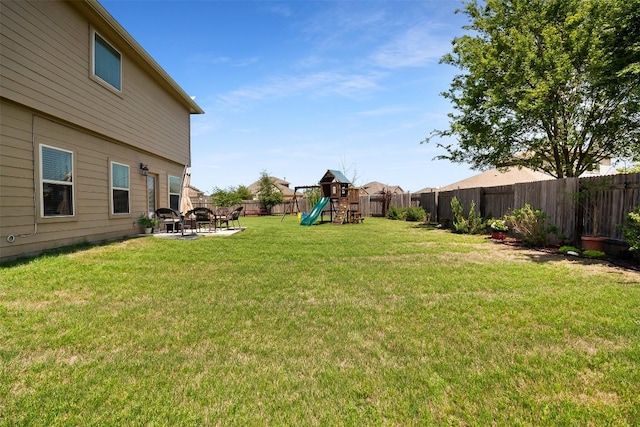 598 Sweet Gum Dr, Kyle, TX 78640 - view of yard with a playground, a patio area, and a fire pit