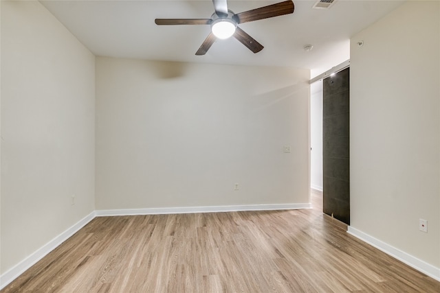 1900 Barton Springs Rd Unit 1009, Austin, TX 78704 - unfurnished room with light wood finished floors and ceiling fan