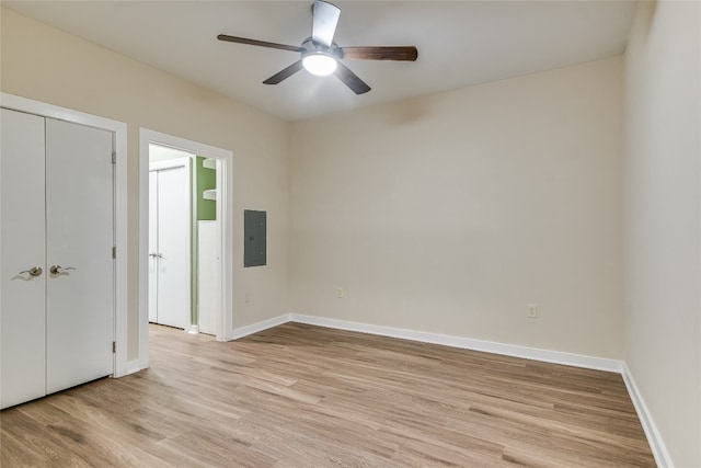 1900 Barton Springs Rd Unit 1009, Austin, TX 78704 - unfurnished bedroom featuring electric panel, light wood finished floors, a closet, and ceiling fan