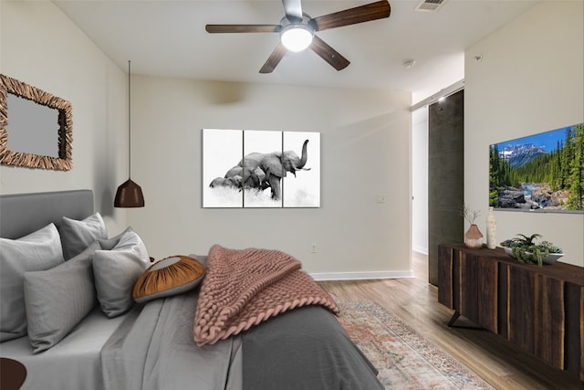 1900 Barton Springs Rd Unit 1009, Austin, TX 78704 - bedroom with light wood-style flooring and ceiling fan